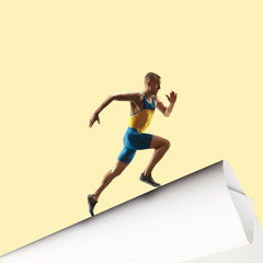 Imagine who's covering white sheet to get digital file icon. Young man, professional runner runs up the edge of huge paper sheet. Digital world, funny imagination of the way the shout appearing.