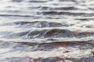 Water surface. Soft waves on a lake.