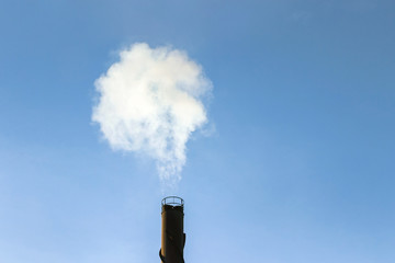 factory chimney with pollution smoke in blue sky 