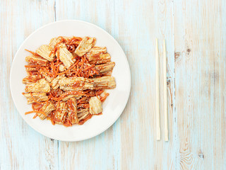 Spicy Chinese or Korean Yuba tofu bamboo and carrots salad on wooden background