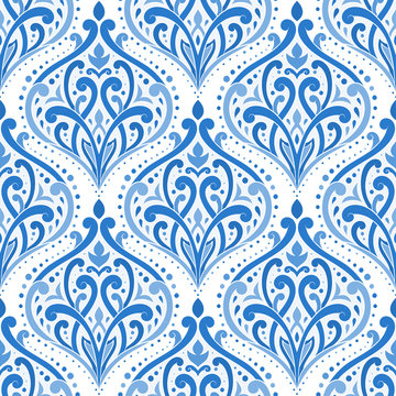 Blue floral seamless pattern with ornamental stripes. Traditional oriental motifs. Vintage ornament template. Decorative paisley elements. Great for fabric and textile.