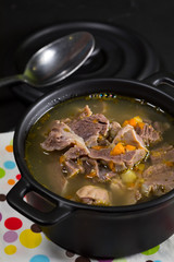 Chicken gizzards stewed with carrot in sauce.