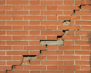 Obraz premium Pared de ladrillo agrietada