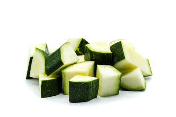 zucchini cubes isolated on white background