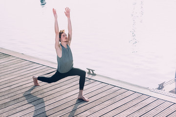 Young man practices yoga to relax from the stress of the city and exercise.