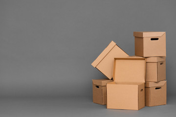 Cardboard box on gray background with copy space.