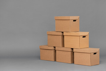 Cardboard box on gray background with copy space.