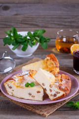 Cottage cheese casserole with raisins and powdered sugar
