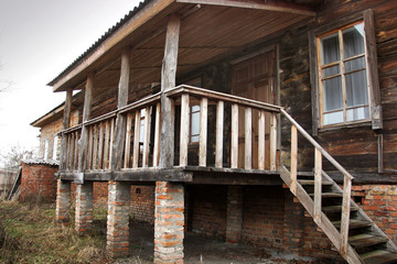 Old house in the village. Wooden steps