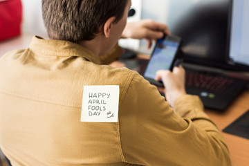 April 1 is day of fools.Funny day.April fish.Practical jokes.Inscriptions on the back.Stickers with jokes.Trick at work. Cheerful colleagues.Glued leaf on back.Colored stickers with inscriptions.