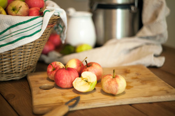 Apples on the table for a fresh juice making. Healthy nutrition concept.
