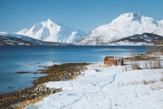 Norway, Old fisherman hut in Winter landscape