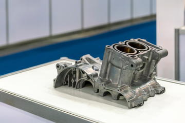 aluminum or alloy engine cylinder block for automobile part from high pressure die casting manufacturing process on table