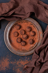 Sweet chocolate truffles sprinkled with cocoa powder