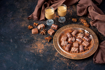  Sweet chocolate candy with liqueur in shot glass, dessert table