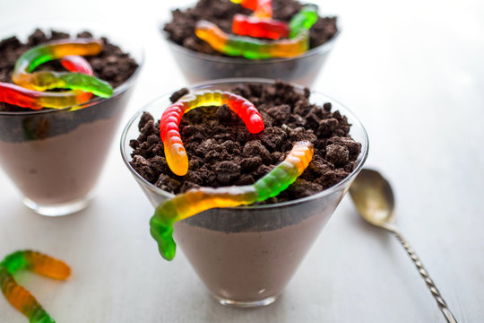 Close up view of dirt cups and gummy worms