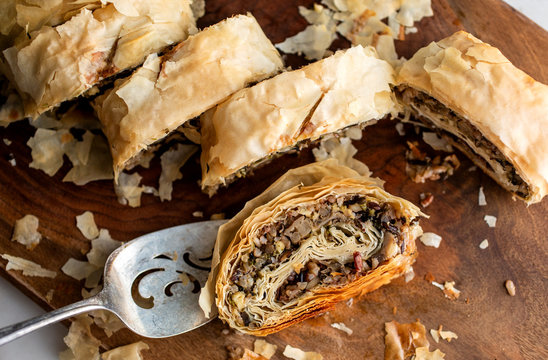 Close up of mushroom and wild rice strudel on cutting board