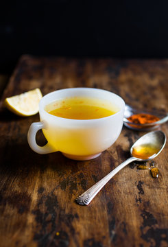Tilt shift view of lemon and turmeric infused tea