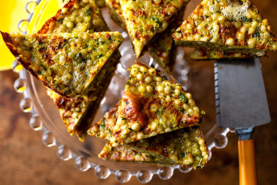 Close up of Israeli couscous and spicy herb frittata