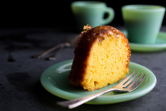 Slice of rum cake placed in plate