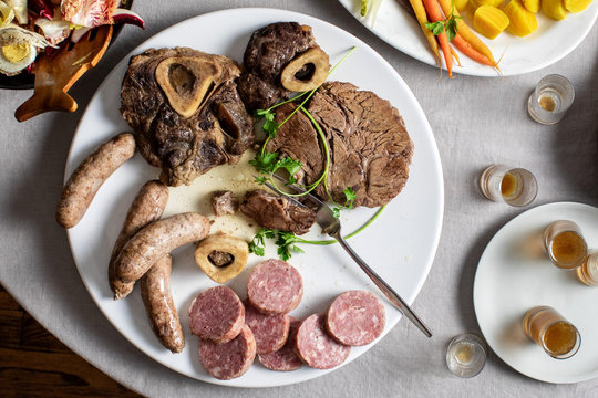 Bollito misto with vegetables, two dipping sauces, and broth