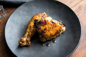 Roasted chicken piece served in plate
