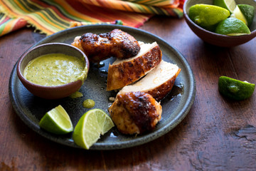 Sliced Peruvian chicken with green chutney