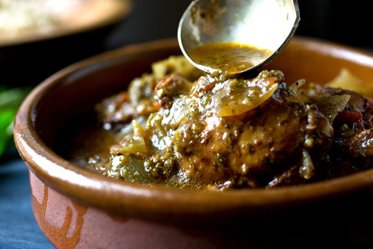 Selective focus of coriander cumin chicken in bowl