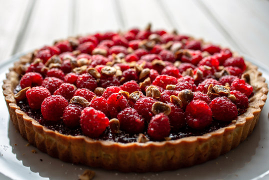 Selective focus of raspberry tart served in plate