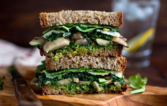 Selective view of sandwich served on wooden board