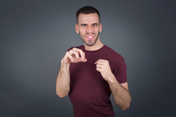 Ugh how disgusting! Displeased unshaven young man dressed casual, says fie and has dissatisfied...