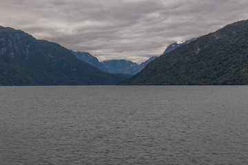 End of fjord. Beautiful Norwegian landscape. view of the fjords. Norway ideal fjord reflection in clear water In cloudy weather. selective focus