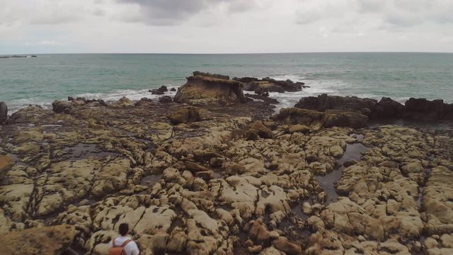 Drone flight inyo the horizon on the beach