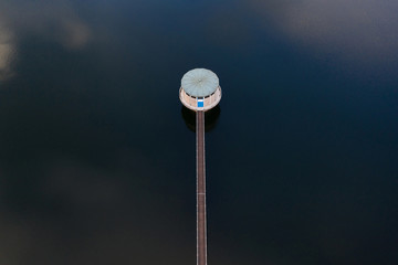 drinking water dam with water tower from above