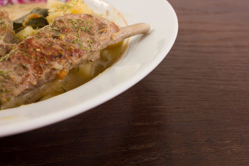 Appetizing boiled potatoes with dill and meat in a plate