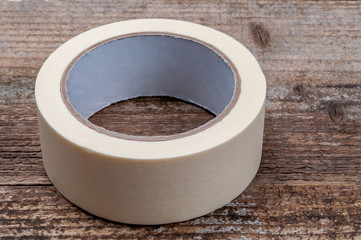 Masking tape on wooden background.