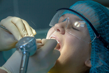 A child at the dentist's appointment. Dental treatment and brushing in the doctor’s office....