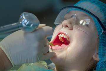 A child at the dentist's appointment. Dental treatment and brushing in the doctor’s office....
