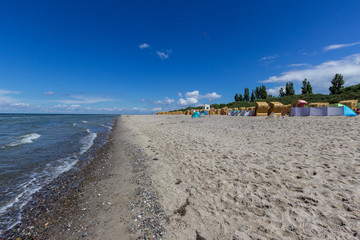 Obraz premium Scenic view at beach on Poel island at the Baltic sea with beach chairs and say