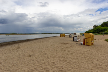 Scenic view at  beach on Poel island at the Baltic sea with beach chairs and say