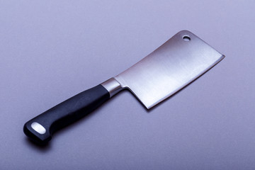 Vintage hatchet for meat on grey board with copy space.