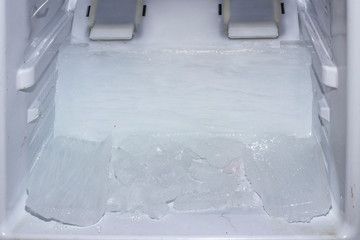 frozen ice on the inside of the refrigerator chamber with the 