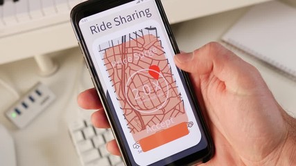Getting a Price surge notification from a ride share app on a mobile phone. User accepting the hike in price and reserving his ride. - Powered by Adobe