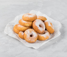 Cottage cheese doughnuts with milk on a light background