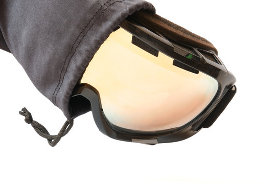 Ski goggles with reflective mirror, partly pulled out from its black  textile pouch/cloth bag, isolated on white background. Stock Photo | Adobe  Stock