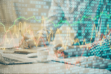 Multi exposure of forex chart with man working on computer on background. Concept of market analysis.