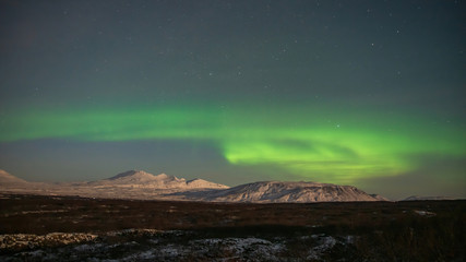 Fototapeta na wymiar Northern lights at the night sky of Iceland 