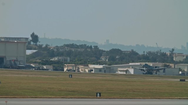 Kadena AB Okinawa Japan Feb 21 2020 Military aircraft taking off and on runway fighter jet, refueler, air tanker, A10, F15,C130 USAF