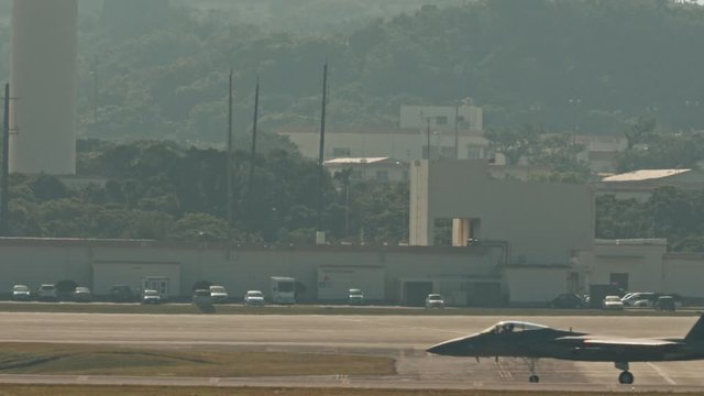 Kadena AB Okinawa Japan Feb 21 2020 Military aircraft taking off and on runway fighter jet, refueler, air tanker, A10, F15,C130 USAF