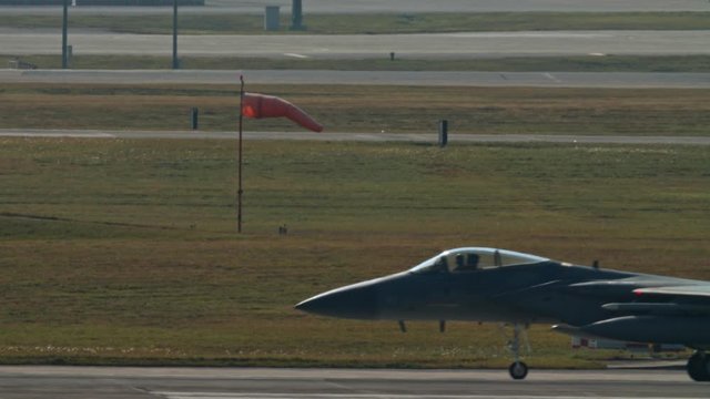 Kadena AB Okinawa Japan Feb 21 2020 Military aircraft taking off and on runway fighter jet, refueler, air tanker, A10, F15,C130 USAF